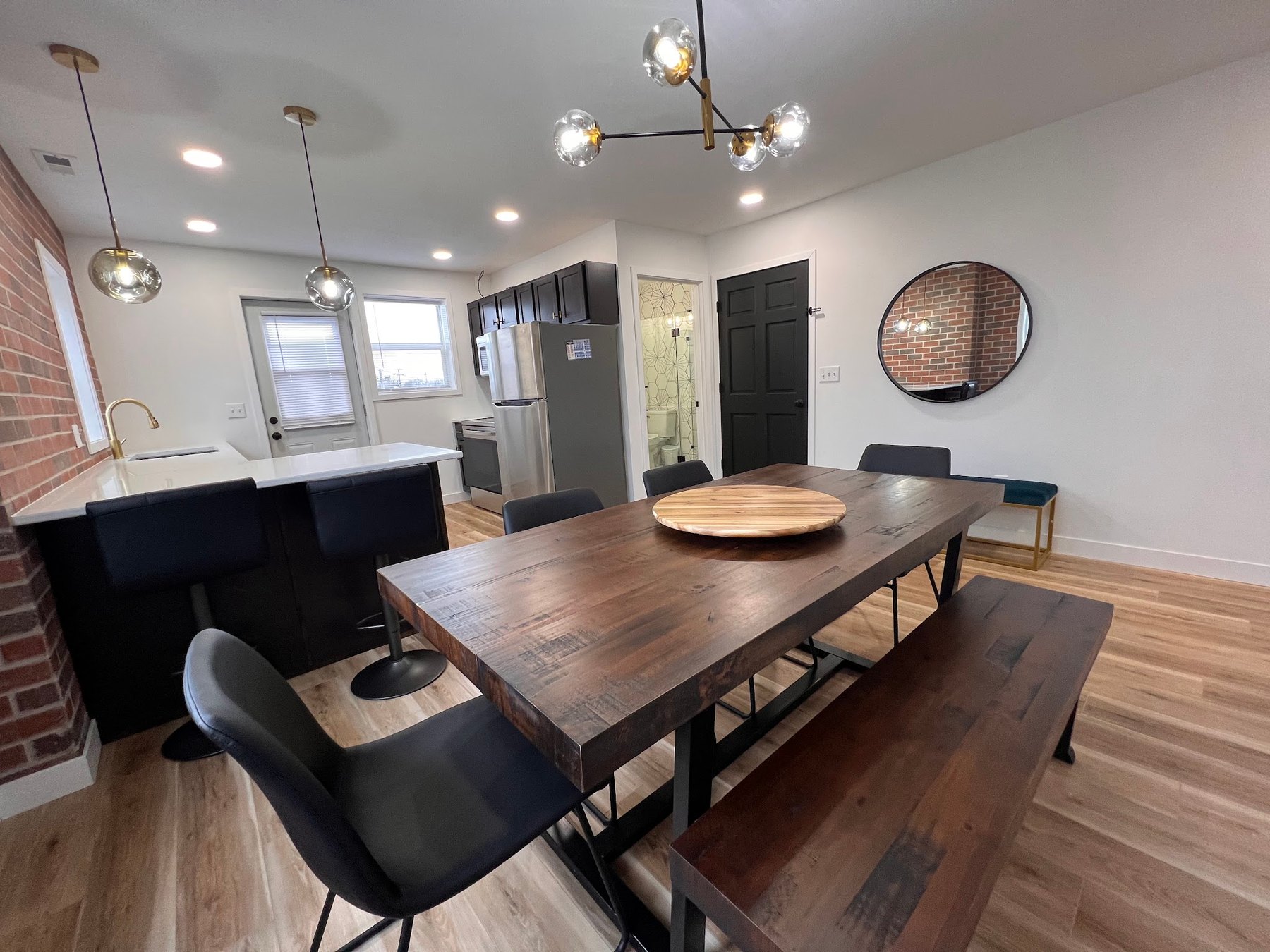 A restored dining room with exposed brick